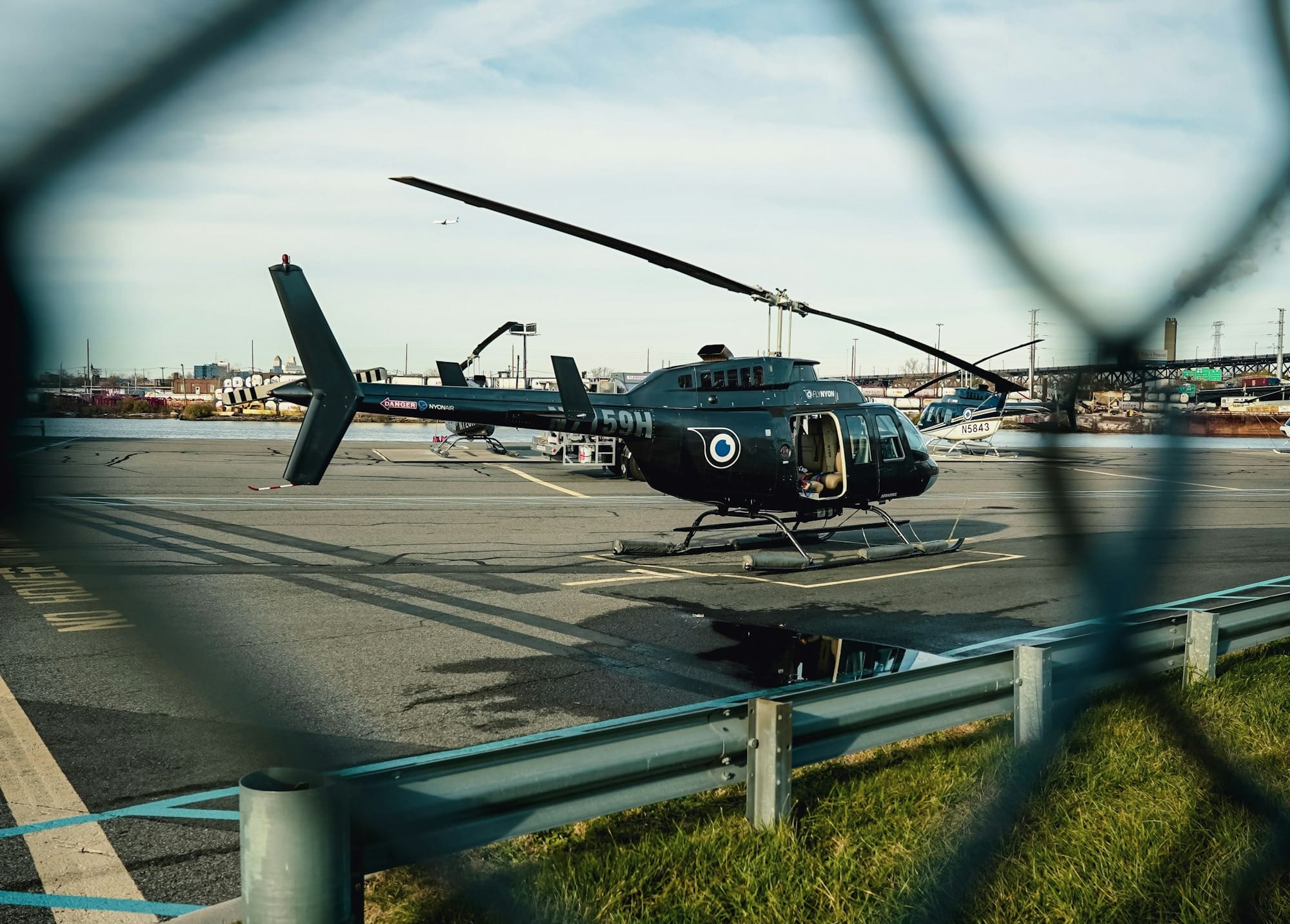 a helicopter sitting on top of an airport tarmac